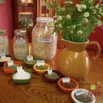 Display of sage, fennel, oats, and others herbs and spices, mixes in jars