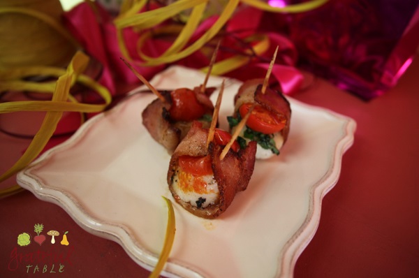 Wrap scallops in lightly-browned bacon, top w/tomato, basil, & broil