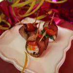 Wrap scallops in lightly-browned bacon, top w/tomato, basil, & broil